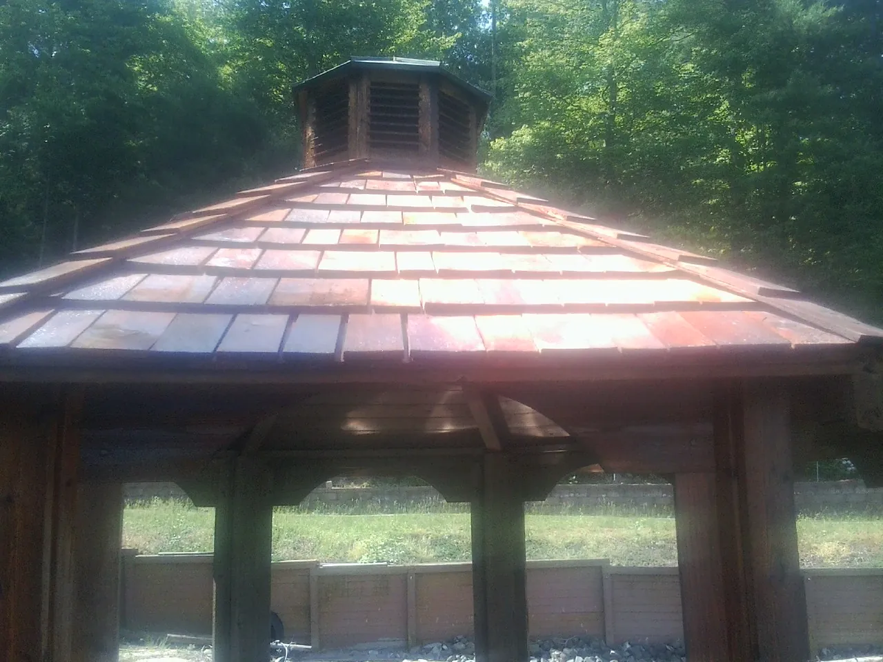 New cedar shake roof and cupola on a lakeside gazebo in Lagrange
